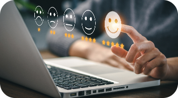 A person's hand giving a five-star rating on a laptop, selecting the smiley face icon from a row of various expressions ranging from sad to happy.